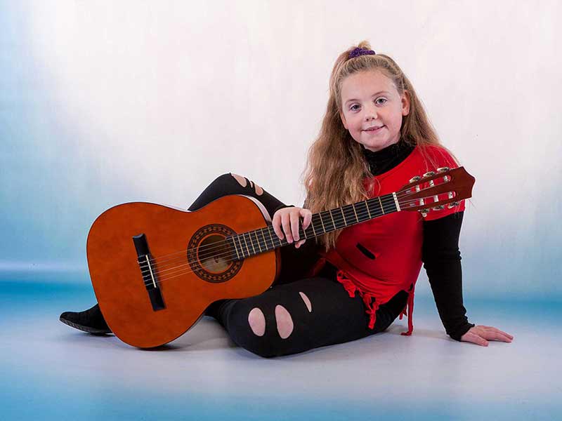 Hobbies child portrait image guitar